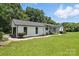 Well-maintained home with landscaped yard and appealing curb appeal at 7109 Forney Hill Rd, Denver, NC 28037