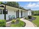 Charming home featuring a cozy front porch with seating and beautifully landscaped front yard at 7109 Forney Hill Rd, Denver, NC 28037