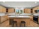 Bright kitchen featuring a center island, wood cabinets, and modern appliances at 7109 Forney Hill Rd, Denver, NC 28037