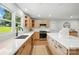 Well-lit kitchen with island, stainless steel appliances, and stylish countertops at 7109 Forney Hill Rd, Denver, NC 28037