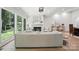 Elegant living room with a fireplace, large windows, and stylish decor at 7109 Forney Hill Rd, Denver, NC 28037