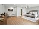 Cozy main bedroom boasts a decorative chandelier, soft natural light, and a neutral color palette at 7109 Forney Hill Rd, Denver, NC 28037