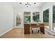 Bright home office with natural light, a functional desk setup, and views of the outdoors at 7109 Forney Hill Rd, Denver, NC 28037