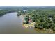 Scenic aerial view of a waterfront property, highlighting lake access and a peaceful wooded area at 735 Pebble Pt, Salisbury, NC 28146