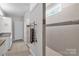 Bright bathroom with a tiled walk-in shower and a modern towel rack feature at 735 Pebble Pt, Salisbury, NC 28146