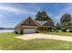 Brick home boasts an attached garage and a well-manicured lawn at 735 Pebble Pt, Salisbury, NC 28146