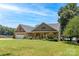 Lovely brick home with mature landscaping, featuring a two-car garage and lake views from the front yard at 735 Pebble Pt, Salisbury, NC 28146