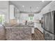 Bright kitchen features modern appliances, ample white cabinets, and stylish countertops at 735 Pebble Pt, Salisbury, NC 28146