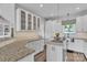 Modern kitchen offers custom cabinets, granite counters, and a central island at 735 Pebble Pt, Salisbury, NC 28146