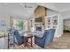 Living room with stone fireplace, hardwood floors, and lake views at 735 Pebble Pt, Salisbury, NC 28146