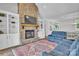 Living room with stone fireplace, hardwood floors, built-ins, and comfortable seating at 735 Pebble Pt, Salisbury, NC 28146