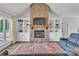 Beautiful living room with stone fireplace, hardwood floors, and built-in shelving at 735 Pebble Pt, Salisbury, NC 28146