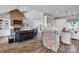 Open-concept living area with fireplace, built-in shelves, and adjacent white kitchen at 735 Pebble Pt, Salisbury, NC 28146