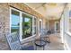 Relaxing porch with rocking chairs overlooking scenic lake views at 735 Pebble Pt, Salisbury, NC 28146