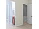 A carpeted bedroom showcasing two doorways and a closet at 8712 Soaring Eagle Ln, Waxhaw, NC 28173