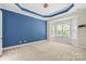 Large bedroom featuring a cozy sitting area by the window and modern color scheme at 8712 Soaring Eagle Ln, Waxhaw, NC 28173