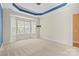 Bright bedroom with large windows and a neutral color palette for a serene atmosphere at 8712 Soaring Eagle Ln, Waxhaw, NC 28173