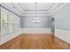 Elegant dining room with hardwood floors, tray ceiling, and classic chandelier at 8712 Soaring Eagle Ln, Waxhaw, NC 28173