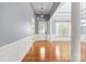 Elegant foyer with hardwood floors, decorative wainscoting, and ample natural light at 8712 Soaring Eagle Ln, Waxhaw, NC 28173