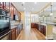 Open kitchen with granite countertops, stainless steel appliances, and hardwood floors at 8712 Soaring Eagle Ln, Waxhaw, NC 28173
