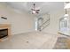 An open living room featuring a fireplace and staircase at 8712 Soaring Eagle Ln, Waxhaw, NC 28173