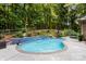 An inviting backyard with a pool, outdoor seating, and mature trees at 107 Creekwood Dr, Dallas, NC 28034