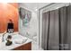 Bathroom featuring a vanity, toilet, and shower with a gray curtain at 107 Creekwood Dr, Dallas, NC 28034