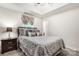 Bedroom with a trey ceiling, neutral decor, and a comfortable-looking bed at 107 Creekwood Dr, Dallas, NC 28034