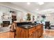 Open kitchen with granite countertops, stainless steel appliances, island cooktop, and barstool seating at 107 Creekwood Dr, Dallas, NC 28034