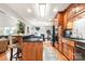 Modern kitchen with granite countertops, stainless steel appliances, and an island overlooking the dining area at 107 Creekwood Dr, Dallas, NC 28034