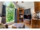 Cozy living room with a large window offering stunning views of lush greenery at 107 Creekwood Dr, Dallas, NC 28034