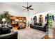 Large living room featuring high ceilings, hardwood floors, and arched doorways offering views of the kitchen at 107 Creekwood Dr, Dallas, NC 28034