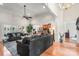 Comfortable living room with hardwood floors leading to the kitchen with stainless steel appliances at 107 Creekwood Dr, Dallas, NC 28034