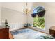 Bright room with hardwood floors, wainscoting, large window and chandelier at 107 Creekwood Dr, Dallas, NC 28034