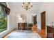 Hardwood floors, large window, nice dresser and a lovely rug make the space feel cozy at 107 Creekwood Dr, Dallas, NC 28034