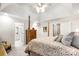 Bedroom featuring a 4-poster bed, neutral decor, and doorway leading to the main bathroom at 107 Creekwood Dr, Dallas, NC 28034