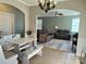 Cozy dining area with cushioned bench seating that opens into the spacious living room at 10825 Traders Ct, Davidson, NC 28036