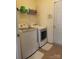 Efficient laundry room featuring modern, front-loading washer and dryer units for convenient chore days at 10825 Traders Ct, Davidson, NC 28036