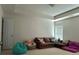 Comfortable living room with a brown couch and natural light from the window, perfect for Gathering time at 10825 Traders Ct, Davidson, NC 28036