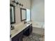 A view of the bathroom that features a double vanity, soaking tub and walk-in shower at 10825 Traders Ct, Davidson, NC 28036