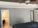 Spacious main bedroom that has a view of the ensuite bathroom and closet at 10825 Traders Ct, Davidson, NC 28036