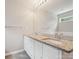 Bathroom features a dual sink vanity with granite countertop, large mirror, and stylish fixtures at 1109 Manchester Ln, Charlotte, NC 28227