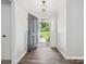 Inviting entryway with hardwood floors and an open view to the front yard at 1109 Manchester Ln, Charlotte, NC 28227