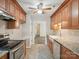 The kitchen showcases wood cabinets, stainless appliances, and an open layout at 1109 Manchester Ln, Charlotte, NC 28227
