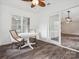 Bright sunroom with wood-look floors features sliding glass doors and a table with seating at 1109 Manchester Ln, Charlotte, NC 28227