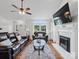 Spacious living room boasts hardwood floors, a cozy fireplace, and a large window offering serene views at 132 General Pemberton St, Stanley, NC 28164