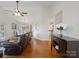Open-concept living room flows into the dining area with hardwood floors and neutral color palette at 132 General Pemberton St, Stanley, NC 28164