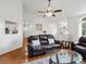 Comfortable living room with hardwood floors, stylish furnishings, and a large window offering plenty of natural light at 132 General Pemberton St, Stanley, NC 28164