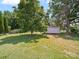 Lush backyard with a storage building at 151 Robinson Rd, Gastonia, NC 28056