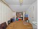 This basement presents an unfinished space with striped wallpaper and some storage opportunities at 151 Robinson Rd, Gastonia, NC 28056
